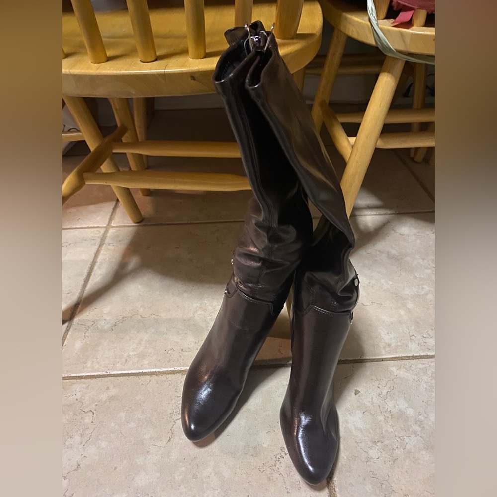 Brown! Never worn pair of high heels boots.